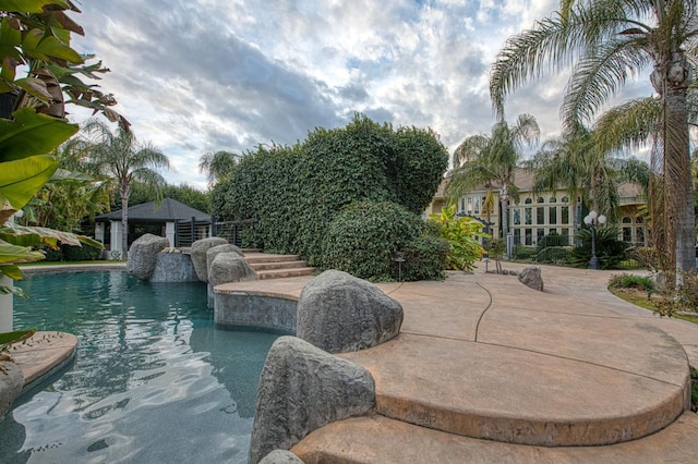 outdoor pool with a patio