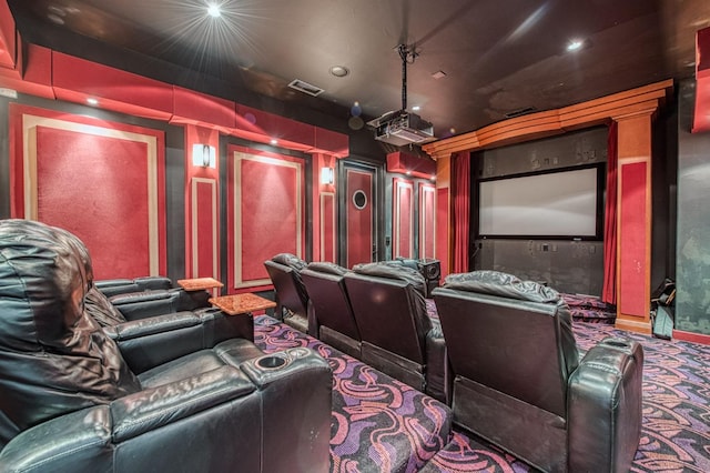 home theater room featuring carpet and visible vents