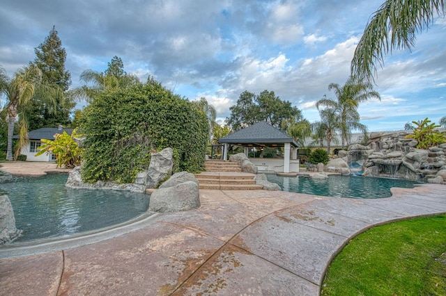 pool featuring a gazebo and a patio