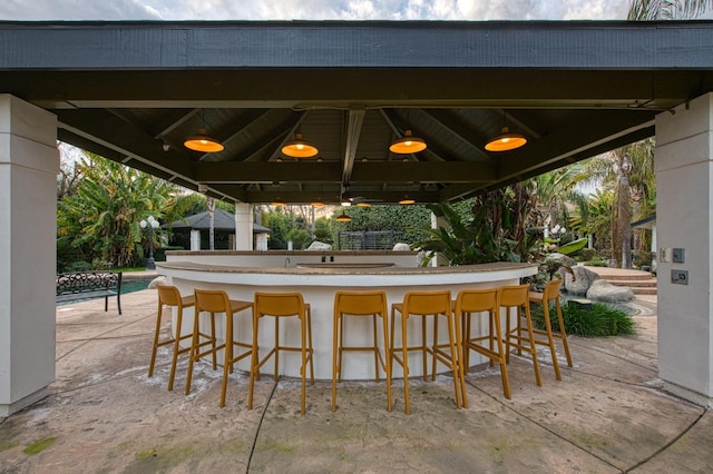 view of patio featuring a gazebo and an outdoor bar