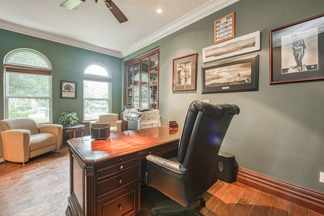 office space with wood finished floors, crown molding, baseboards, and ceiling fan