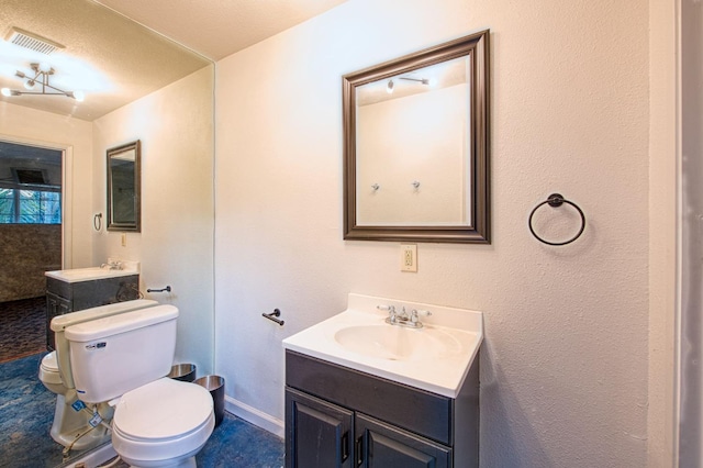 full bath with toilet, visible vents, and vanity