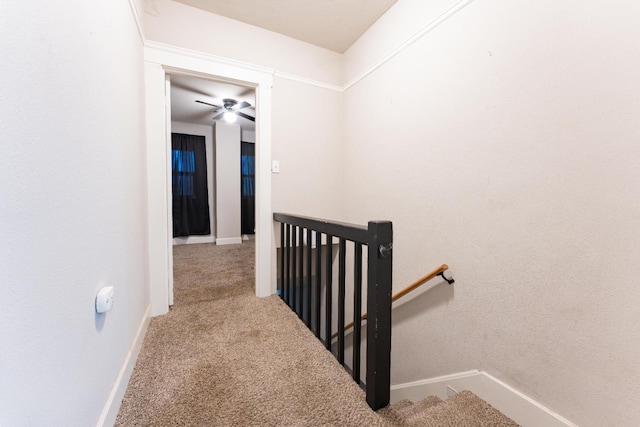 stairs with baseboards and carpet flooring