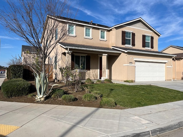 traditional home with an attached garage, driveway, a front lawn, and stucco siding