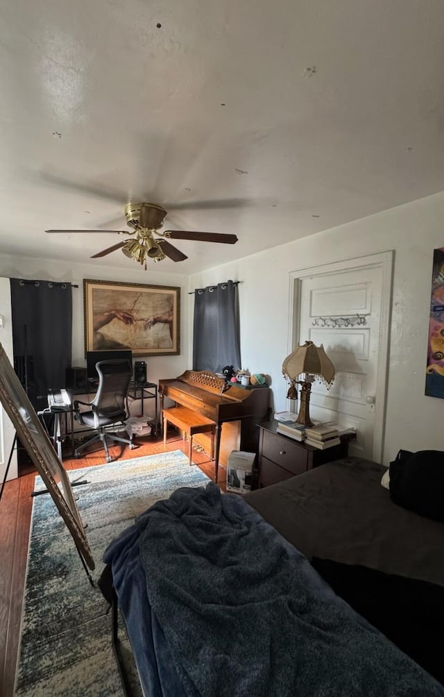 385 N San Pablo Ave, Fresno, CA 93701 - bedroom with a ceiling fan and wood finished floors