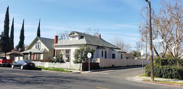 view of front of home featuring a fenced front yard and a residential view