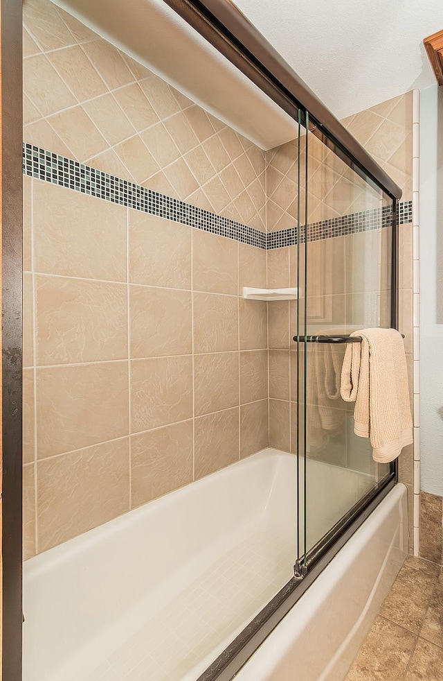 full bathroom featuring shower / bath combination with glass door