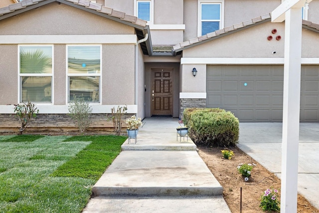 view of exterior entry featuring stone siding and stucco siding