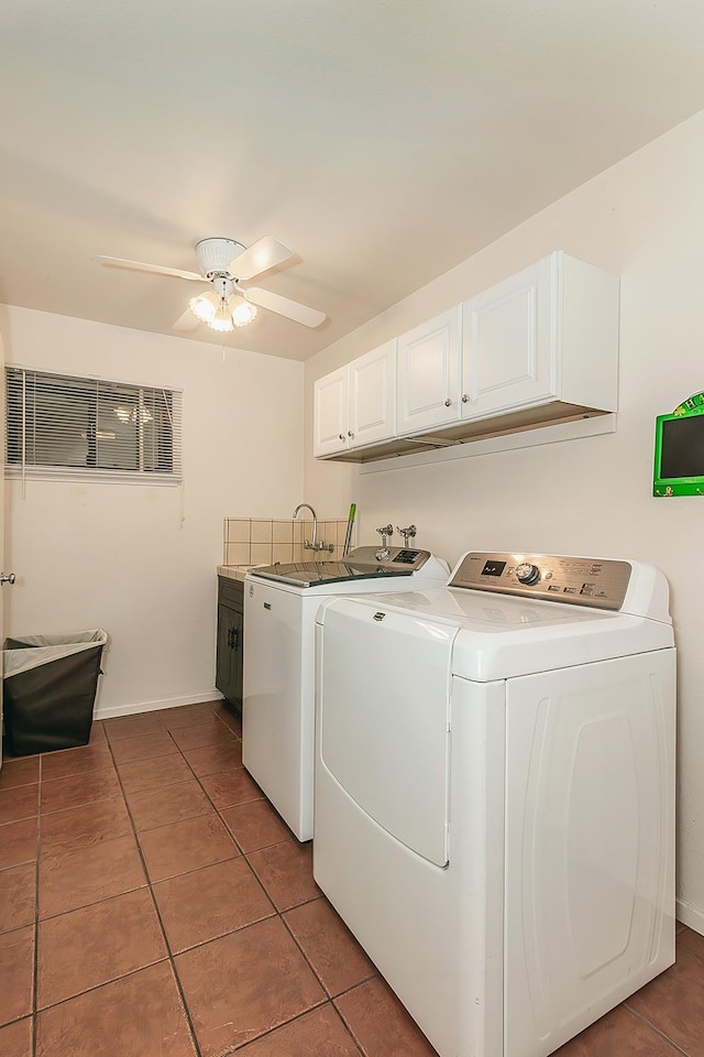 clothes washing area featuring cabinet space, baseboards, ceiling fan, tile patterned flooring, and washer and dryer