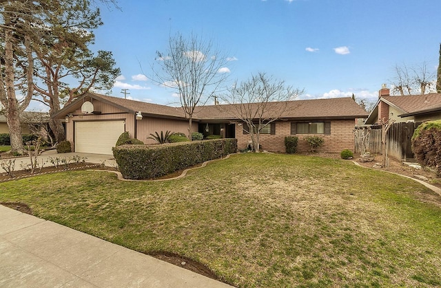 single story home with brick siding, concrete driveway, fence, a garage, and a front lawn