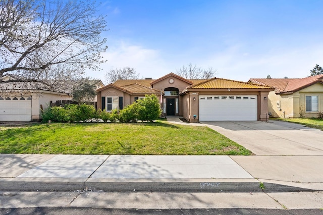 mediterranean / spanish house featuring a garage, driveway, a tiled roof, and stucco siding