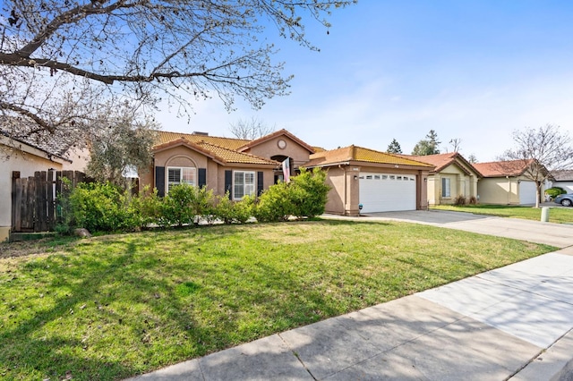 view of front of house with a garage, fence, concrete driveway, a tiled roof, and stucco siding