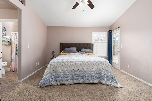 bedroom featuring carpet, lofted ceiling, ensuite bathroom, ceiling fan, and baseboards