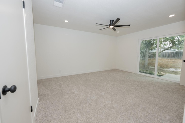 unfurnished room with ceiling fan, recessed lighting, light carpet, visible vents, and baseboards