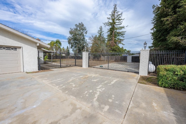 view of gate featuring fence