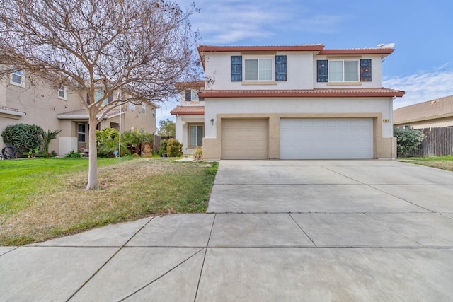 view of front of house featuring a garage, driveway, a tiled roof, and stucco siding