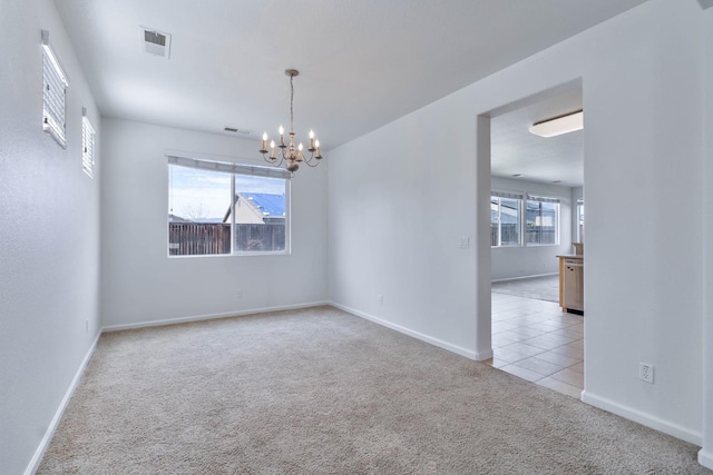 unfurnished room with light tile patterned floors, visible vents, light carpet, a chandelier, and baseboards