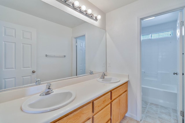 full bathroom featuring washtub / shower combination, tile patterned floors, a sink, and double vanity