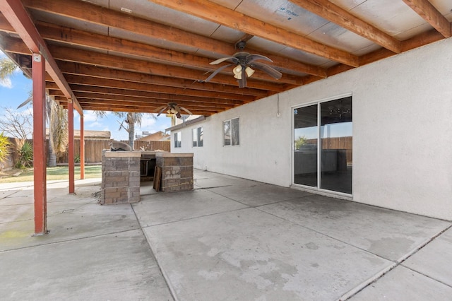 view of patio / terrace featuring outdoor dry bar, ceiling fan, and fence