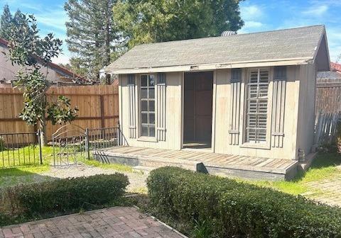 view of shed with a fenced backyard