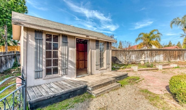 view of shed with a fenced backyard