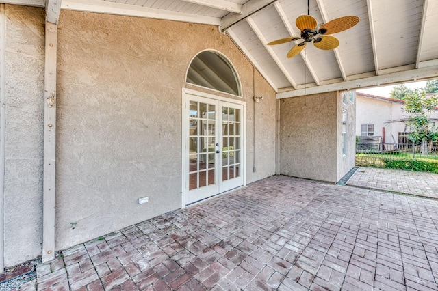 view of patio featuring french doors, fence, and ceiling fan