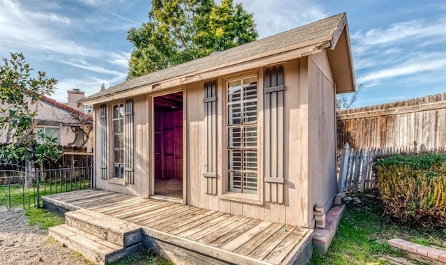 view of shed with fence