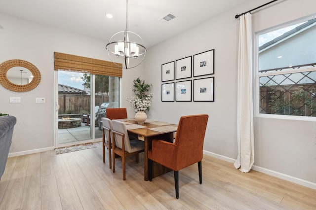 570 Laurel Crest Ave, Madera, CA 93636 - dining space with a chandelier, light wood finished floors, baseboards, and recessed lighting