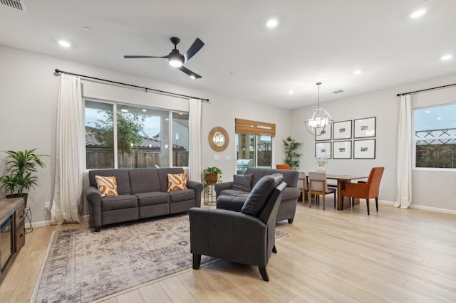 570 Laurel Crest Ave, Madera, CA 93636 - living room with light wood-type flooring, a chandelier, recessed lighting, a ceiling fan, and baseboards