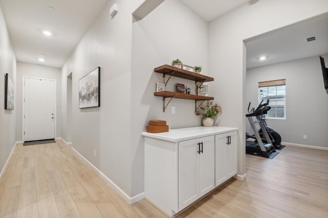 570 Laurel Crest Ave, Madera, CA 93636 - hallway featuring light wood finished floors, baseboards, and recessed lighting