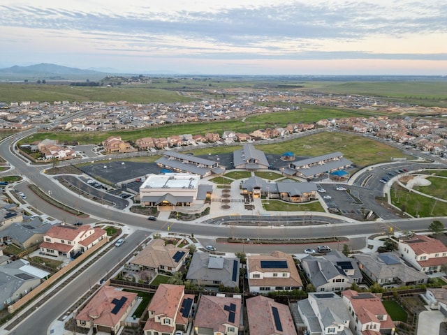 570 Laurel Crest Ave, Madera, CA 93636 - aerial overview of property's location with mountains and nearby suburban area