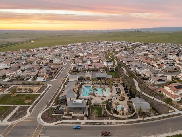 570 Laurel Crest Ave, Madera, CA 93636 - aerial view at dusk of view of pool and a residential view