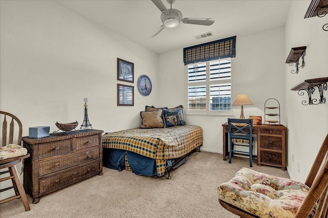 bedroom featuring carpet floors, baseboards, visible vents, and ceiling fan