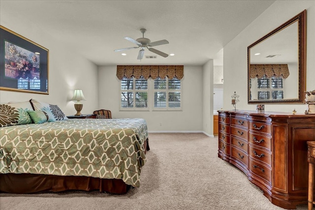 bedroom with baseboards, recessed lighting, visible vents, and light colored carpet