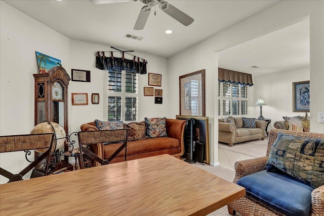 living area featuring ceiling fan, visible vents, and recessed lighting