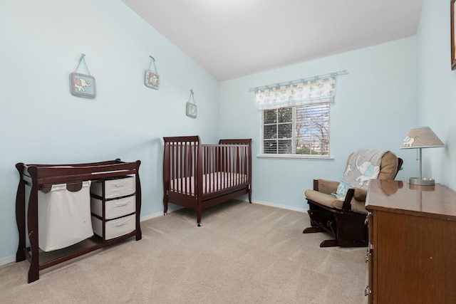 bedroom featuring light colored carpet and baseboards