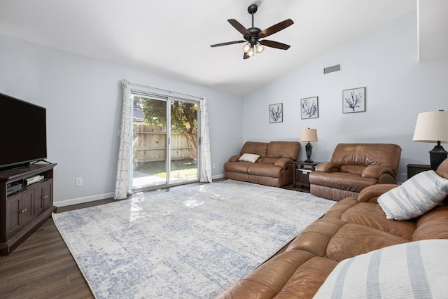 living room with visible vents, dark wood-type flooring, baseboards, vaulted ceiling, and a ceiling fan