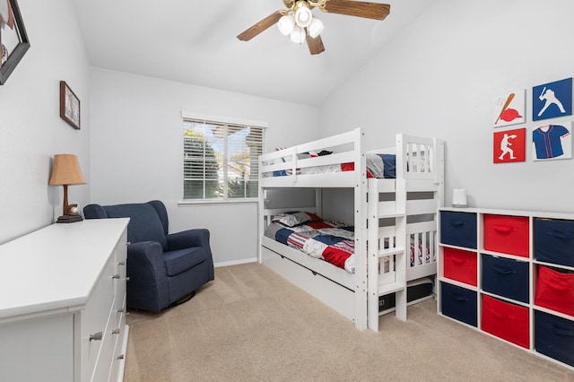 carpeted bedroom featuring vaulted ceiling and ceiling fan