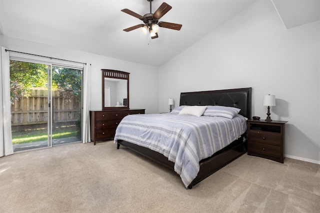 bedroom featuring baseboards, light colored carpet, a ceiling fan, and vaulted ceiling