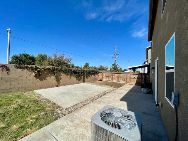 view of patio / terrace featuring a fenced backyard and central AC unit