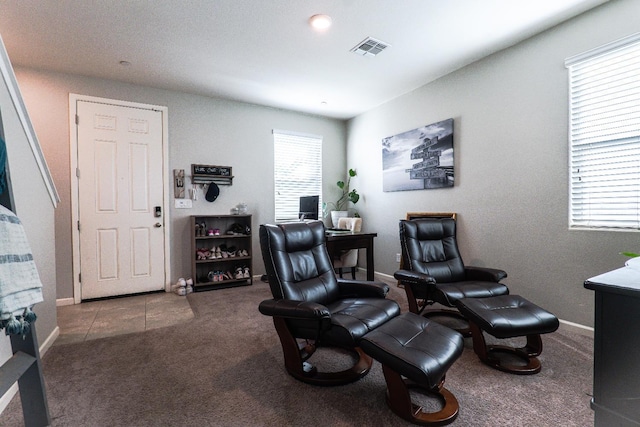 carpeted home office featuring baseboards and visible vents