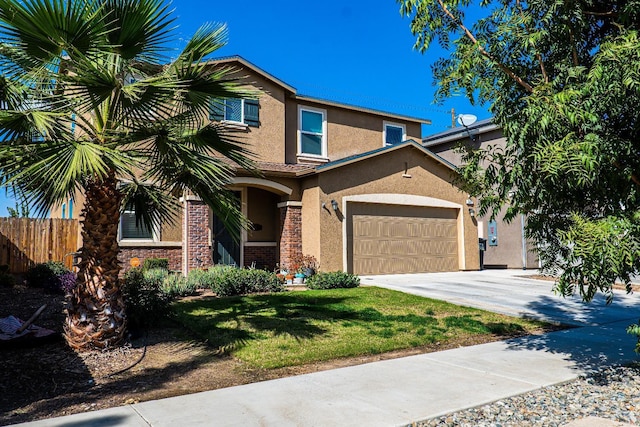 view of front of property with brick siding, fence, driveway, stucco siding, and a front yard