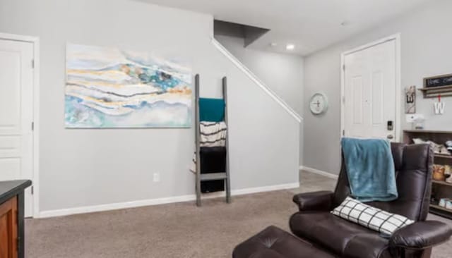 sitting room featuring baseboards, carpet floors, and recessed lighting