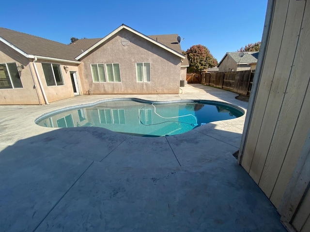 view of pool featuring a fenced in pool, a patio area, and a fenced backyard