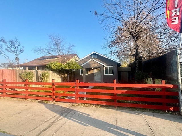 view of front of property with a fenced front yard and stucco siding