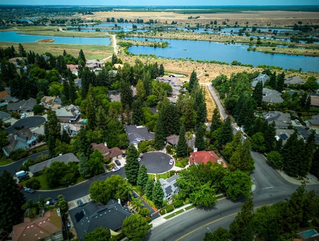 aerial view with a water view and a residential view