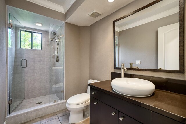 full bathroom featuring ornamental molding, a stall shower, visible vents, and toilet