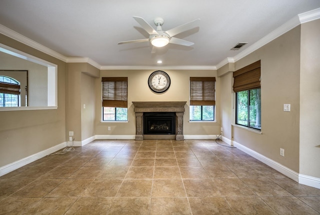 unfurnished living room with baseboards, visible vents, and crown molding