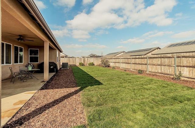 view of yard featuring a patio area, a fenced backyard, a ceiling fan, and central air condition unit