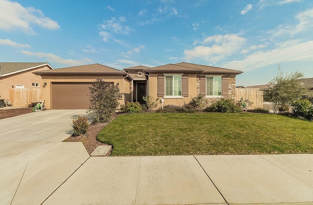 view of front facade with driveway, fence, and stucco siding